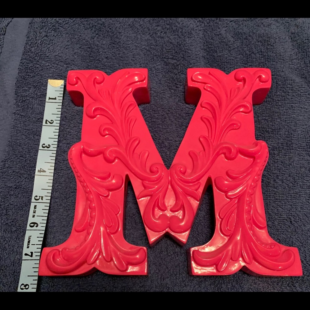 Initial “M”